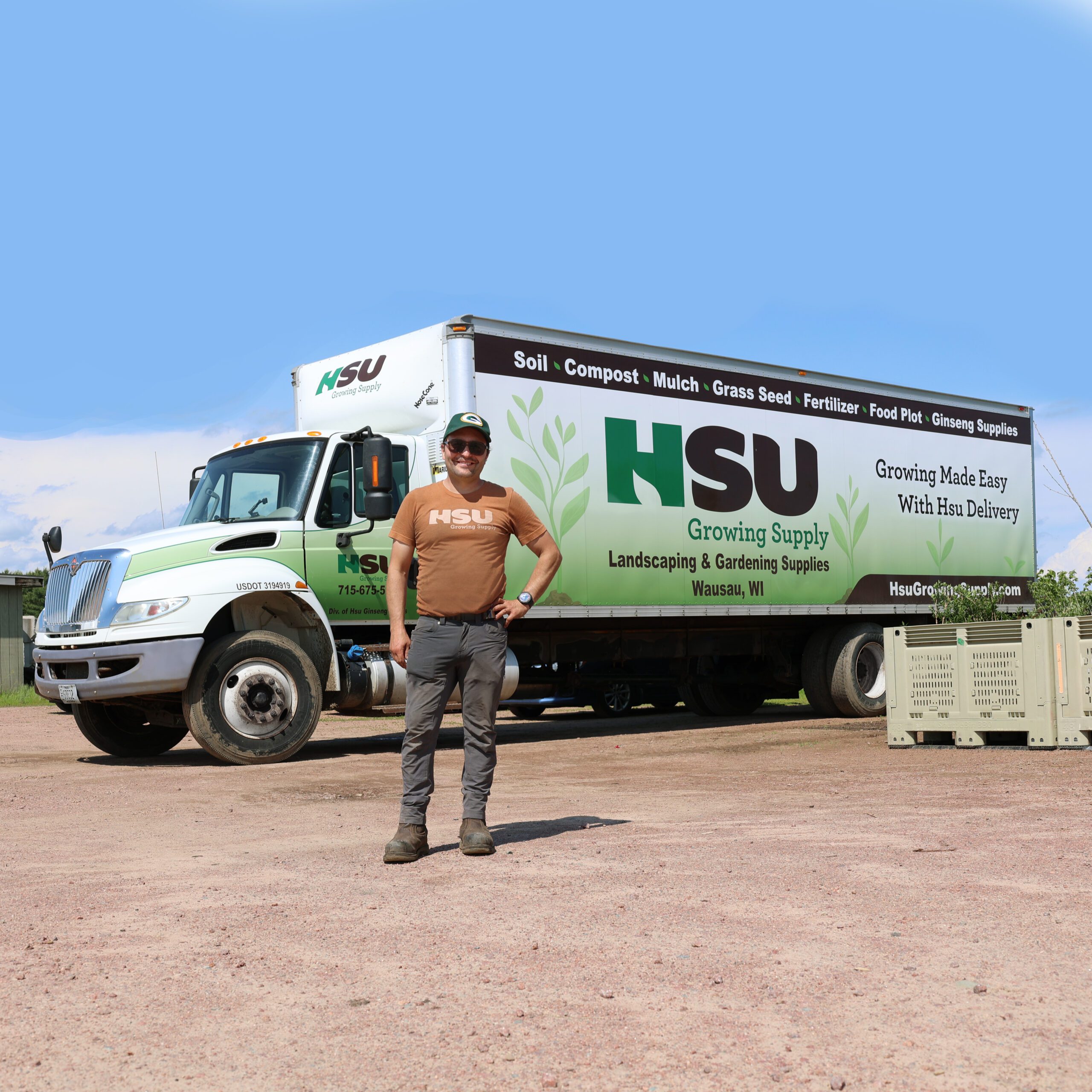 Paul standing in front of the Hsu Growing Supply truck used for the food waste and recycling program.