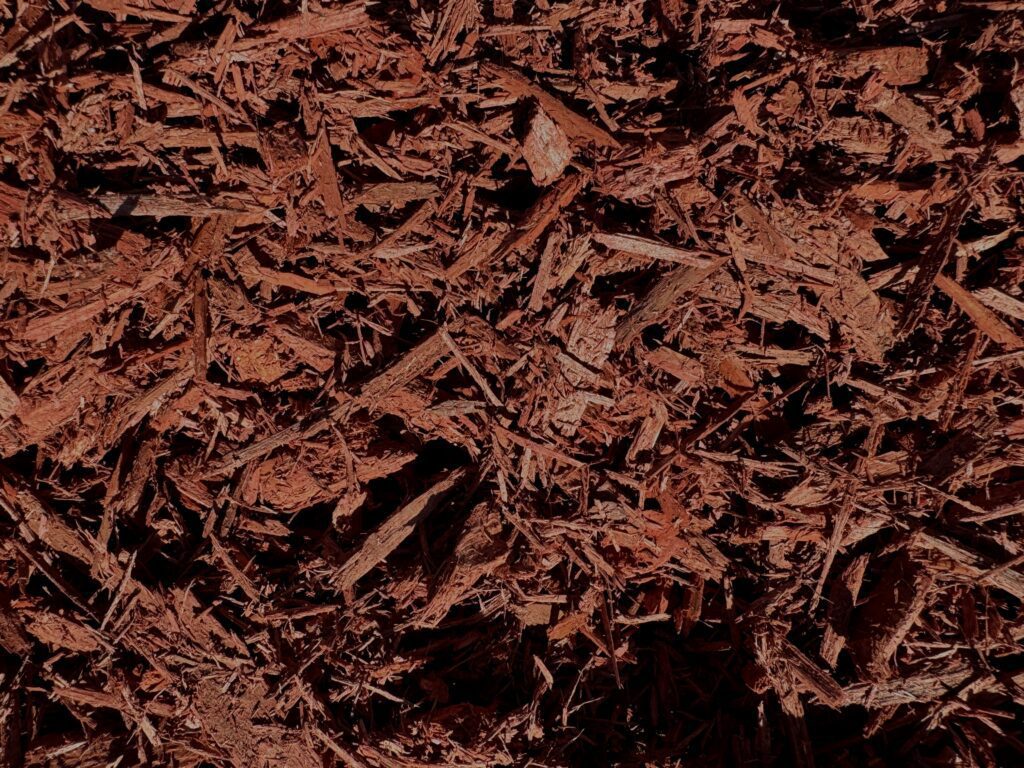 Close-up of HSU Growing Supply Cardinal Red colored mulch.