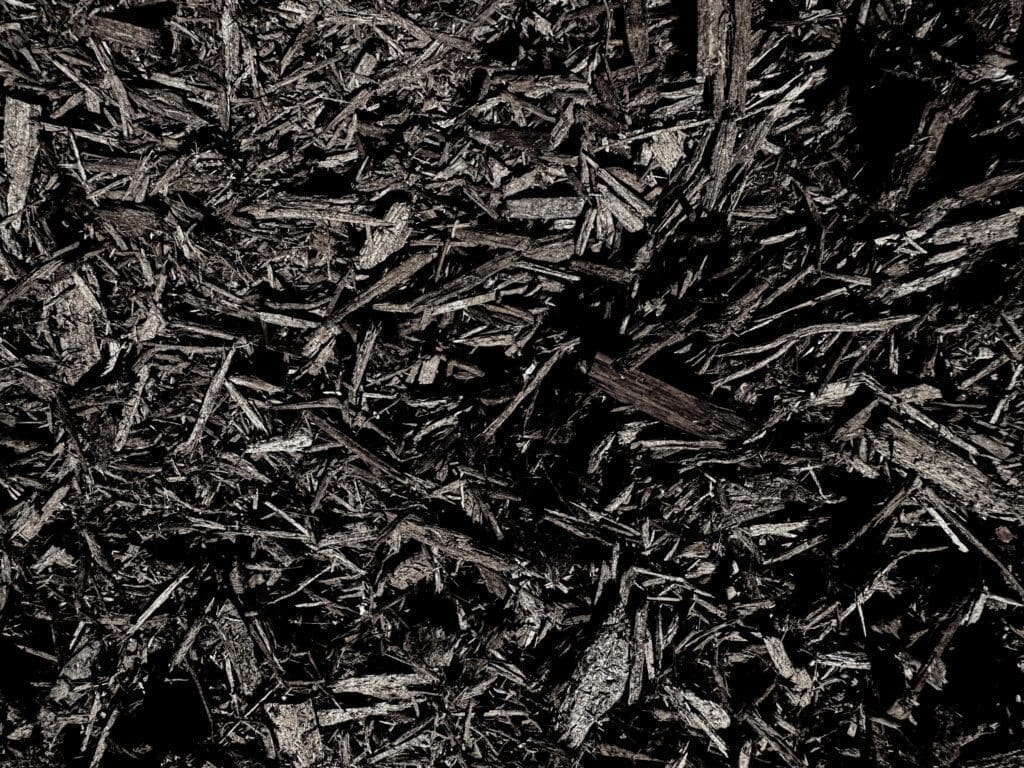 Close-up of HSU Growing Supply Chocolate brown mulch.