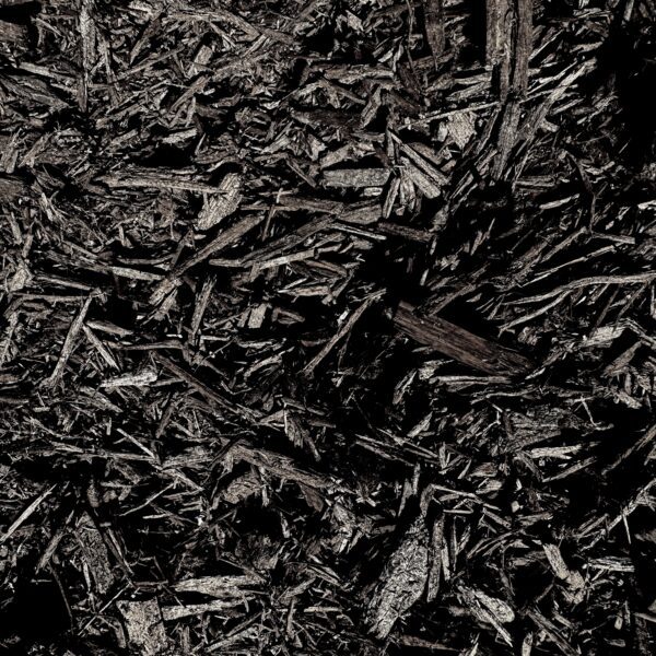 Close-up of HSU Growing Supply Chocolate brown mulch.